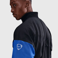 Chelsea Nike Third Anthem Jacket Jacket unisex detail view 4 | Dash Racegear — Chelsea FC 2025-26 Nike anthem training jacket in black and blue side profile.