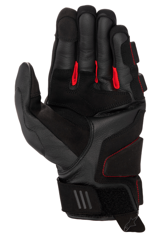 Alpinestars Phenom Leather Gloves, Motorcycle Gloves, Black and Bright Red, palm side view showing premium goat leather, red fabric between fingers, reinforced impact zones, and adjustable velcro wrist closure