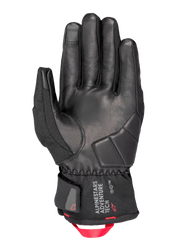 Alpinestars Crestone GORE-TEX Insulated Gloves, Motorcycle Gloves, Black, palm view featuring leather construction with reinforced impact padding, short cuff with Alpinestars Adventure Tech logo, and a bright red webbing pull loop