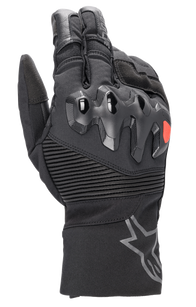 Alpinestars Bogota Drystar XF Gloves, full-length motorcycle touring gloves, black with a red logo accent, featuring over-injected knuckle protection, ribbed stretch wrist panels, and a long cuff with a grey star logo.