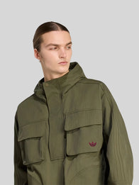 Vincent Kompany Adidas Jacket Jacket unisex detail view 4 | Dash Racegear — Vincent Kompany olive green Adidas jacket, breathable sporty fabric, unisex fit for training and casual outings.