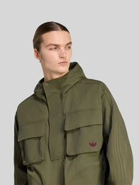 Vincent Kompany Adidas Jacket Jacket unisex detail view 4 | Dash Racegear — Vincent Kompany olive green Adidas jacket, breathable sporty fabric, unisex fit for training and casual outings.