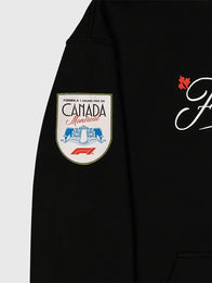 F1 Canada GP 2026 MTL Badge Hoodie Hoodie unisex detail view 4 | Dash Racegear — Black pullover hoodie featuring F1 Canada GP 2026 MTL badge and relaxed unisex fit for everyday wear.