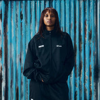 Corteiz x Gabriel Moses Track Jacket Jacket unisex front product view | Dash Racegear — Black 2026 Regina track jacket from Corteiz x Gabriel Moses, unisex street zip layer for everyday casual wear.