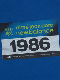 ALD x New Balance Running Bib T-Shirt Shirt unisex detail view 4 | Dash Racegear — New Balance x Aimé Leon Dore 2026 Blue Running Bib Unisex T-Shirt with a relaxed fit and modern athletic style.