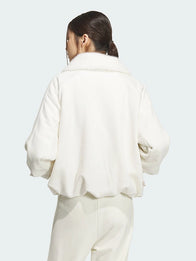 Adidas Lunar New Year Warm Jacket Jacket unisex detail view 2 | Dash Racegear — Fans wear the Adidas Lunar New Year 2026 Warm Jacket in off white for festive street style in winter.