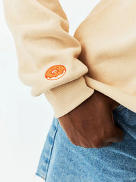 Parke x Dunkin’ Varsity Mockneck Cream Sweatshirt Sweatshirt unisex detail view 3 | Dash Racegear — Parke x Dunkin' 2026 women's fleece sweatshirt blending varsity-inspired design with soft all-day comfort.