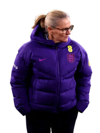 Sarina Wiegman Women’s International Friendly Match Puffer Jacket Puffer Jacket unisex detail view 5 | Dash Racegear — Sarina Wiegman England Lionesses Women’s International Friendly Nike Hood Puffer Jacket with insulated panels, ideal for fan outings.