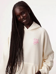 Sincerely Yours Gloss Pocket Hoodie Hoodie unisex detail view 3 | Dash Racegear — Cream hoodie featuring a glossy pocket detail, designed in a soft streetwear style inspired by Salish Matter Sincerely Yours collection.