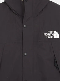 The North Face x Sky High Farm Rain Jacket Jacket unisex detail view 5 | Dash Racegear — The North Face Sky High Farm black graphic rain jacket, relaxed unisex fit for everyday rainy-day wear.