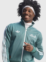 Adidas x Bob Marley Track Jacket Jacket unisex front product view | Dash Racegear — Adidas x Bob Marley “Football is Freedom” Track Jacket for men and women, Green with bold graphic and relaxed fit.