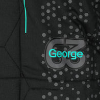 FIA and Tommy Hilfiger labels on George Russell 2024 F1-inspired race suit