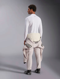 Alpinestars ZX Evo V3 Long Sleeve Top, White, rear view of a model wearing the lightweight flame-resistant base layer with a racing suit tied around the waist, professional motorsport gear for auto racing.