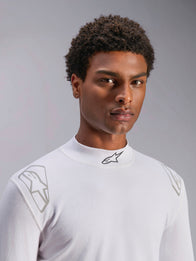 Alpinestars ZX Evo V3 Top - Long Sleeve, White Auto Racing Base Layer, worn by a male model, mock neck with black Alpinestars logo, silver graphic prints on the shoulders, lightweight flame-resistant motorsport underwear