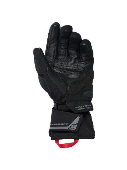 Alpinestars WT-8 GORE-TEX Insulated Gloves, Motorcycle Gloves, Black, inner palm view showing reinforced leather patches and padded sliders, long cuff with a red pull loop and Alpinestars Exploration Equipment branding with geographic coordinates, technical road and adventure design