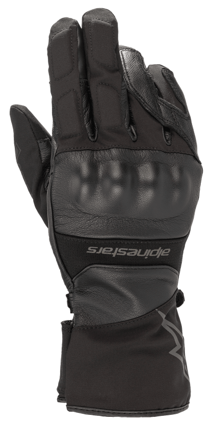 Alpinestars Range 2 In One GORE-TEX Glove With Goregrip Tech, Black motorcycle glove, back of hand view featuring a molded knuckle protector, leather and fabric construction, long cuff with Alpinestars branding, waterproof adventure touring gear