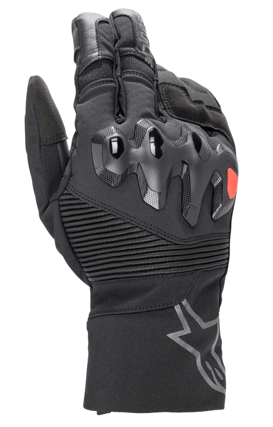 Alpinestars Bogota Drystar XF Gloves, full-length motorcycle touring gloves, black with a red logo accent, featuring over-injected knuckle protection, ribbed stretch wrist panels, and a long cuff with a grey star logo.