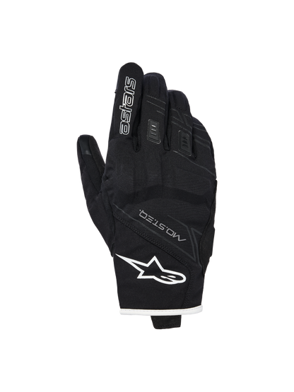 Alpinestars Stella Moblast Waterproof Gloves, Women's Motorcycle Gloves, Black with white trim, backhand view showing Alpinestars logo, MO.ST.EQ branding, and soft knuckle protection.