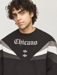 Adidas x Willy Chavarria Chicano Crewneck 2.0 Sweatshirt Sweatshirt unisex detail view 4 | Dash Racegear — Adidas x Willy Chavarria Chicano 2.0 crewneck in black featuring bold front graphics and a unisex relaxed silhouette.