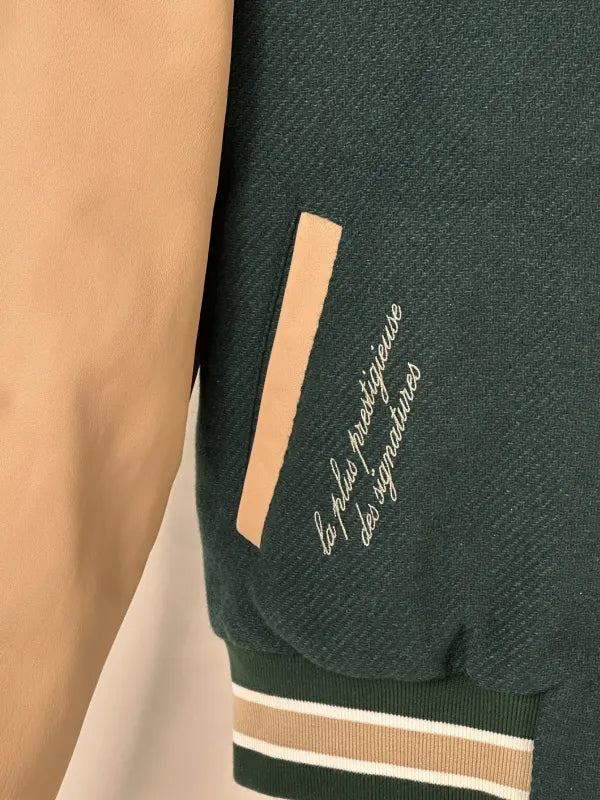 Audemars Piguet 150th Anniversary Jacket Jacket unisex detail view 3 | Dash Racegear — Green varsity‑style Audemars Piguet jacket featuring anniversary crest and sleek snap‑front closure.