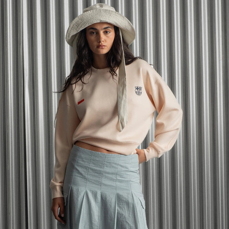 Barça Crew Essentials Sweatshirt Sweatshirt unisex detail view 2 | Dash Racegear — Peach-colored unisex fleece sweatshirt from Barça Essentials 2025 Collection.