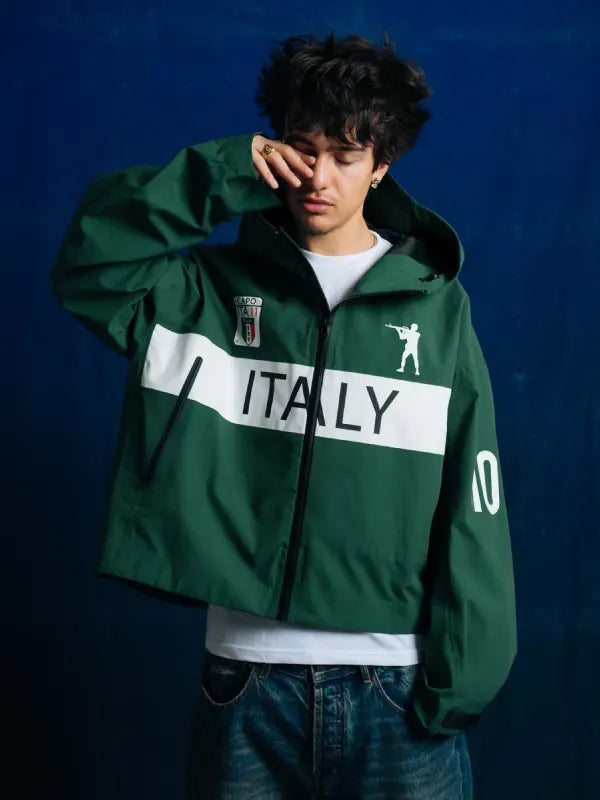 Bravest Italy Jacket Jacket unisex front product view | Dash Racegear — Bravest Italy Hooded Shell Jacket in green with lightweight fabric and hood, perfect for streetwear fans on breezy days.