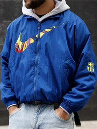 Nike FC Barcelona Essential Jacket Jacket unisex detail view 2 | Dash Racegear — Show team pride in the FC Barcelona Blue Nike Essentials Jacket, perfect for casual wear or match days.