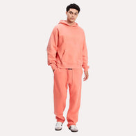 Fear of God Coral Essentials Tracksuit Tracksuit unisex front product view | Dash Racegear — Essentials by Fear of God Tracksuit – Vibrant Coral Edition