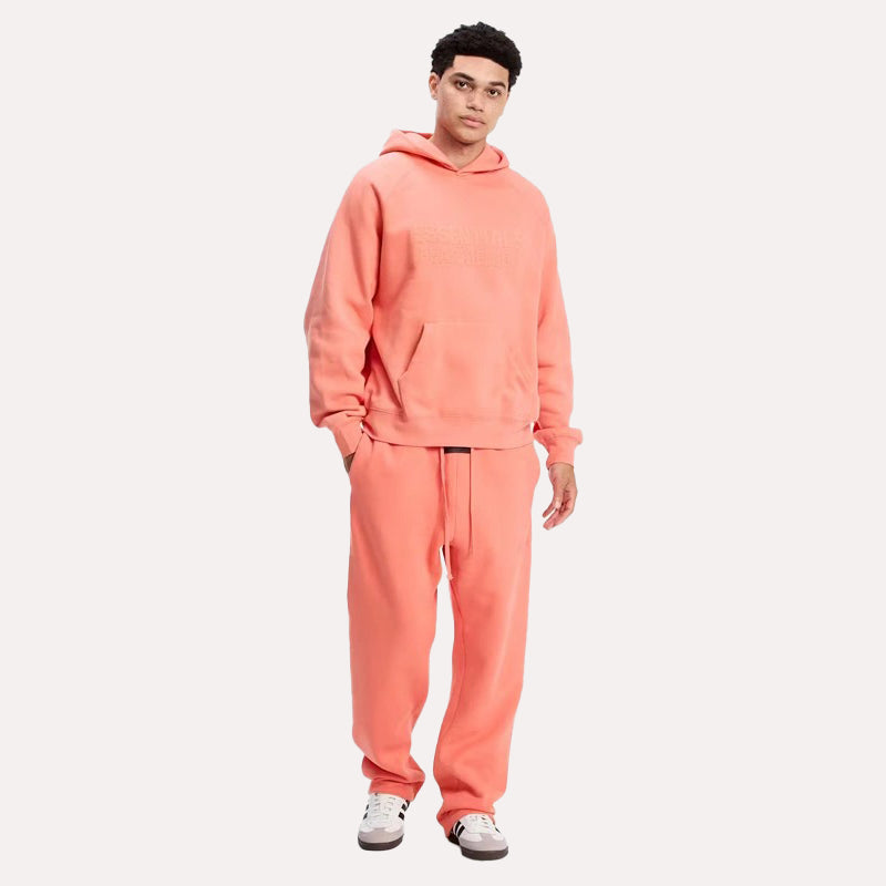 Fear of God Coral Essentials Tracksuit Tracksuit unisex front product view | Dash Racegear — Essentials by Fear of God Tracksuit – Vibrant Coral Edition