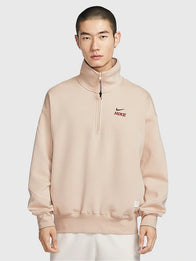Nike Sportswear Year of the Horse Half-Zip Sweatshirt Sweatshirt unisex front product view | Dash Racegear — Soft Nike Sportswear China quarter-zip sweatshirt in beige with clean athletic silhouette