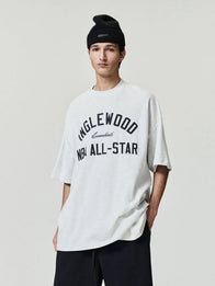 Essentials Inglewood x All Star Weekend T-Shirt Shirt unisex detail view 3 | Dash Racegear — Soft grey 90s-style T-shirt from Essentials Inglewood x All Star Weekend '26 with bold retro logos.