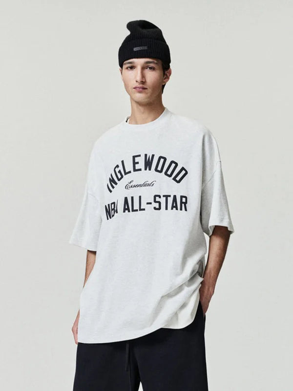 Essentials Inglewood x All Star Weekend T-Shirt Shirt unisex detail view 3 | Dash Racegear — Soft grey 90s-style T-shirt from Essentials Inglewood x All Star Weekend '26 with bold retro logos.