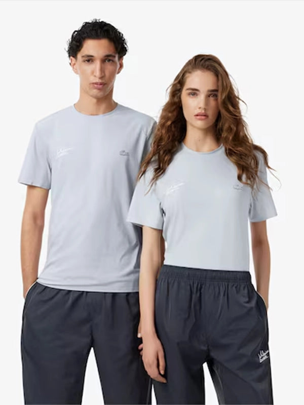 Lacoste x Alpine Graphic T-Shirt Shirt unisex front product view | Dash Racegear — Lacoste x Alpine Unisex Light Grey Graphic T-Shirt 2026 featuring a soft feel, relaxed fit, and modern sporty graphic style.