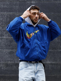 Nike FC Barcelona Essential Jacket Jacket unisex front product view | Dash Racegear — FC Barcelona Nike Essentials Blue Jacket keeps fans warm with sleek design and bold club-inspired style.