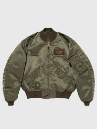Pokemon x Human Made Satin Bomber Jacket Bomber Jacket unisex front product view | Dash Racegear — Olive green satin bomber jacket blending Pokémon graphics with Human Made design for a modern unisex fashion look.