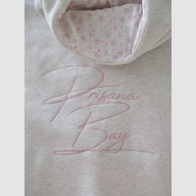 PrisanaBay Bow Hoodie Hoodie unisex detail view 4 | Dash Racegear — Chic PrisanaBay pullover showcasing elegant bow touch