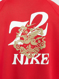 Nike Sportswear Year of the Horse Hoodie Hoodie unisex detail view 3 | Dash Racegear — Red pullover fleece hoodie showcasing cultural design elements inspired by the Year of the Horse