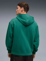 PUMA x Aston Martin Aramco F1 Hoodie Hoodie unisex detail view 2 | Dash Racegear — Unisex PUMA x Aston Martin Aramco F1 Team Green Hoodie featuring lightweight fleece and zip front, great for daily layering.