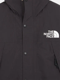 The North Face x Sky High Farm Rain Jacket Jacket unisex detail view 5 | Dash Racegear — The North Face Sky High Farm black graphic rain jacket, relaxed unisex fit for everyday rainy-day wear.