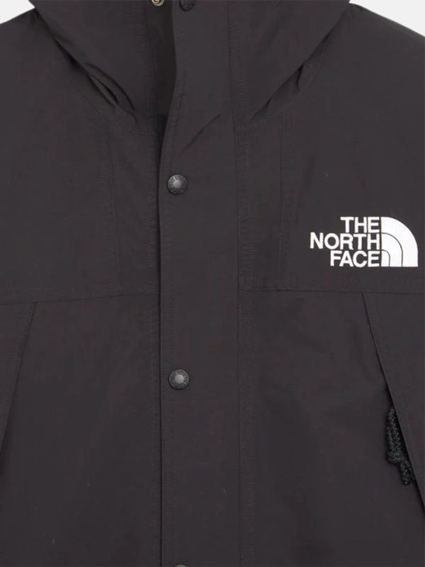 The North Face x Sky High Farm Rain Jacket Jacket unisex detail view 5 | Dash Racegear — The North Face Sky High Farm black graphic rain jacket, relaxed unisex fit for everyday rainy-day wear.