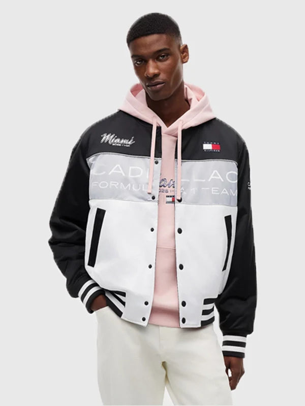 Tommy Hilfiger x Cadillac F1 Team Miami Varsity Jacket Varsity Jacket unisex front product view | Dash Racegear — Tommy Hilfiger x Cadillac 2026 F1 Team Miami Varsity Jacket Black & White bold color-block design with snap closure for unisex race-day wear
