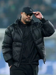 UEFA Champions League Vincent Kompany Puffer Jacket Puffer Jacket unisex detail view 2 | Dash Racegear — Vincent Kompany 2026 black puffer jacket at Signal Iduna Park, UEFA Champions League warm stadium outerwear.