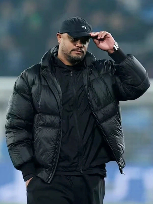 UEFA Champions League Vincent Kompany Puffer Jacket Puffer Jacket unisex detail view 2 | Dash Racegear — Vincent Kompany 2026 black puffer jacket at Signal Iduna Park, UEFA Champions League warm stadium outerwear.
