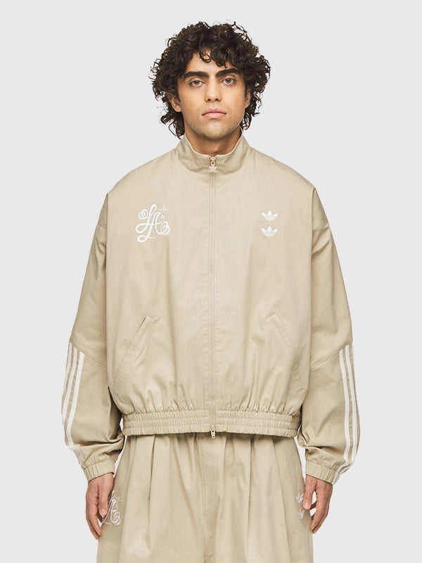Adidas x Willy Chavarria Compton Cowboys Chino Track Jacket Jacket unisex detail view 3 | Dash Racegear — Adidas x Willy Chavarria x Compton Cowboys chino beige track jacket with ribbed collar and zip pockets for everyday cool looks.