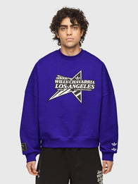Adidas x Willy Chavarria Star Logo Crewneck Sweatshirt Sweatshirt unisex detail view 3 | Dash Racegear — Cozy blue Adidas x Willy Chavarria long‑sleeve crewneck sweatshirt with classic sportswear vibe for all genders.