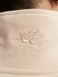 Nike Sportswear Year of the Horse Half-Zip Sweatshirt Sweatshirt unisex detail view 3 | Dash Racegear — Nike quarter-zip sweatshirt in light beige featuring a relaxed fit and subtle seasonal design elements
