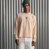 Barça Essentials Graphic Crew Sweatshirt Sweatshirt unisex detail view 3 | Dash Racegear — Peach crewneck with 2025 Barça Essentials branding and design.