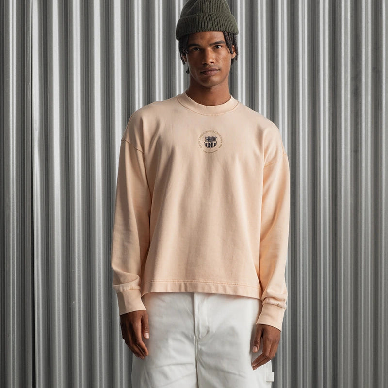 Barça Essentials Graphic Crew Sweatshirt Sweatshirt unisex detail view 3 | Dash Racegear — Peach crewneck with 2025 Barça Essentials branding and design.