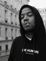 Off White x Kid Cudi Be Human Hoodie Hoodie unisex front product view | Dash Racegear — Off White x Kid Cudi 2026 Be Human black fleece pullover hoodie with bold graphic for casual streetwear.