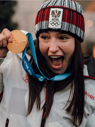 Winter Olympics 2026 Team Austria Opening Ceremony Jacket Jacket unisex detail view 5 | Dash Racegear — Milano Cortina 2026 Opening Ceremony grey hooded jacket featuring Team Austria logo and cozy winter styling.